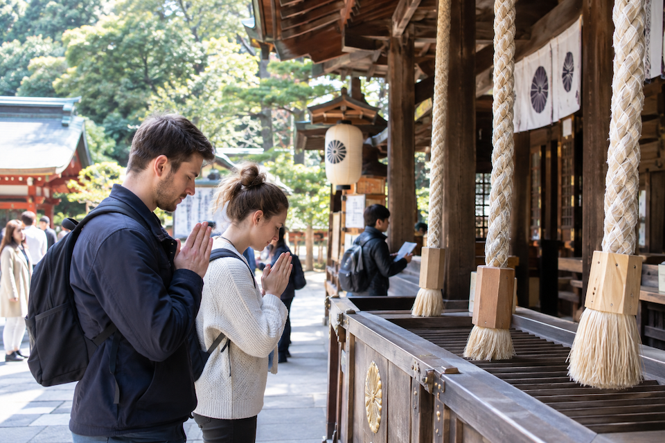 Foreign tourists visiting a shrine